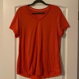Tangerine  ladies athletic top.  Size: L.  Good condition! Photo 0