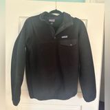 Black  quarterzip button jacket size small Photo 0