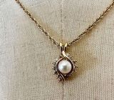 Gold tone faux pearl and rhinestone pendant necklace Photo 0
