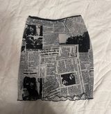 Princess Polly mini skirt with a newspaper type print Photo 0