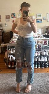 High Rise Light Wash Ripped Jeans Photo 0