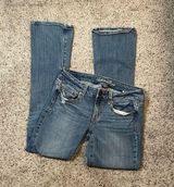 Light Wash Ripped Skinny Kick Bootcut Jean Size 8 Photo 0