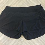 Lululemon Women’s Speed Up MR Black 4” Inseam Shorts - Size 14 Tall Photo 0