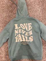 Love Never Fails Hoodie Size L Photo 0