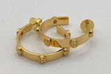 Tory Burch large gold tone hoops with iconic double T logo. Photo 0
