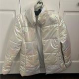 COPY - New Balance Women’s Iridescent Puffer Jacket Photo 0