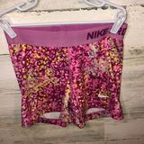 Nike printed spandex shorts yellow and pink in color size small workout … Photo 0