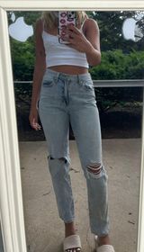 Ripped Mid Rise Jeans Photo 0