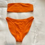 SKIMS Swim Bandeau Bikini Top and Mid Coverage Bottoms in Bright Orange Bikini Set Photo 0