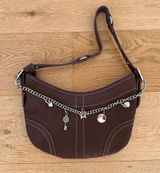 White Fox Boutique - Caroline Faux Suede Charm Shoulder Bag in Brown & Silver Photo 0