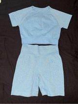 Blue shirt and biker shorts athletic set Photo 0