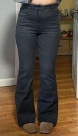 Next Level Stretch Black Curvy Super High-Rise Flare Jeans Photo 0