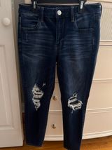 Next Level Stretch Distressed Skinny Jeans Photo 0