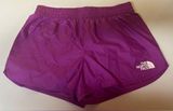 Purple north face running shorts with back zip pocket and reflectors Photo 0