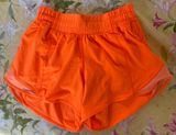 Lululemon Hotty Hot Shorts  Size~ 2 4” Bright Orange color  EUC Photo 0