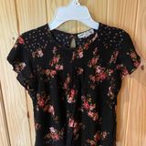 Jolt Black Top with Vibrant Floral Accents Photo 0