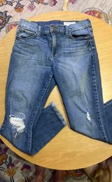Boutique denim jeans with frayed bottoms Photo 0