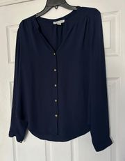 button down blouse is a junior size Large.