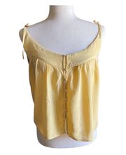NWOT-O’NEILL-YELLOW BUTTON  FRONT TOP-SIZE MEDIUM Adorable yellow top, straps tie at the shoulders, loose fit, 100% viscose Measurements: Bust: armpit to armpit 19 inches  Length: shoulder to bottom 22 inches