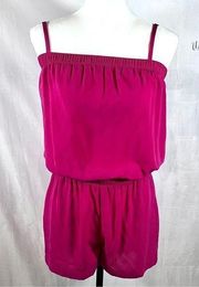 pink open back romper with pockets size small