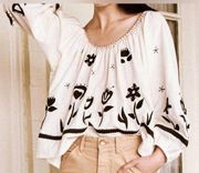 THE GREAT. the blouson top with long stem floral applique in cream