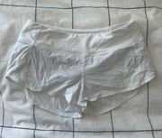 white mid rise speed up shorts (2.5”)