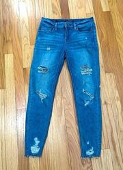 Skinny low rise distressed jeans