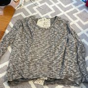 Jella C. Size M Cropped front Sweater. Open back with white lace.