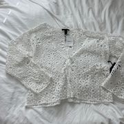 eyelet cardigan  Size small Condition: NWT  Color: white  Details : - Can be worn as cardigan or cover up  - So cute  - Tie in front