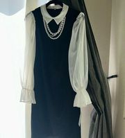 NWT. Shelby and Palmer. Black and white dress with attached pearl necklace.