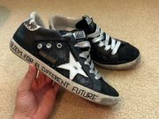 Golden goose black silver and sparkle sneakers.