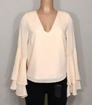 V-neck bell sleeved blouse. NWOT