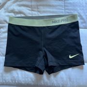 yellow and black nike pros