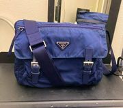 Prada, Vela nylon messenger bag in navy blue.