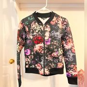 Bebe  Sport Zip up Jacket Black With Floral Print Bomber style.