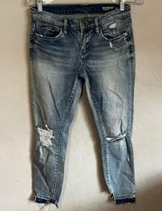 The Reade Crop Distressed Released Raw Hem Denim Jeans