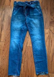 distressed belted blue jeans. Size 7