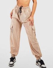 Boohoo windbreaker nude tan beige khaki baggy cargo pants drawstring joggers siz