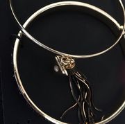 2 Guess Bangles, One w tassel and stone, 1 Black