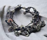 Fossil multi cord bracelet with silver flowers and discs