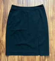 black pencil skirt with short front leg slit