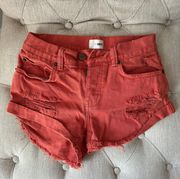 red ripped shorts