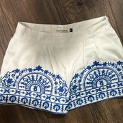 B.Original white dress shorts with blue embroidered designs