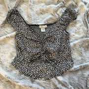 blank and pink cheetah print flowy crop top.