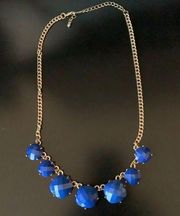 Francesca’s blue necklace with gold chain