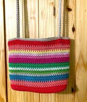 The Sak bright multi-colored woven shoulder bag in EUC