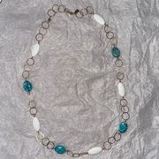 Gold long necklace with white and turquoise beads