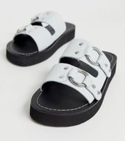 DESIGN Ficton premium leather hardware flat sandals in white