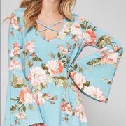 Light blue floral top. Size M