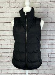 Black Fleece Lined Puffer Vest. Exterior is in excellent condition. Interior has marks from the dryer. They can’t be seen when worn. See all pics. Fleece lined pockets. Collar can be worn up or down. 24” long 16.5” bust approximately   Gorpcorp